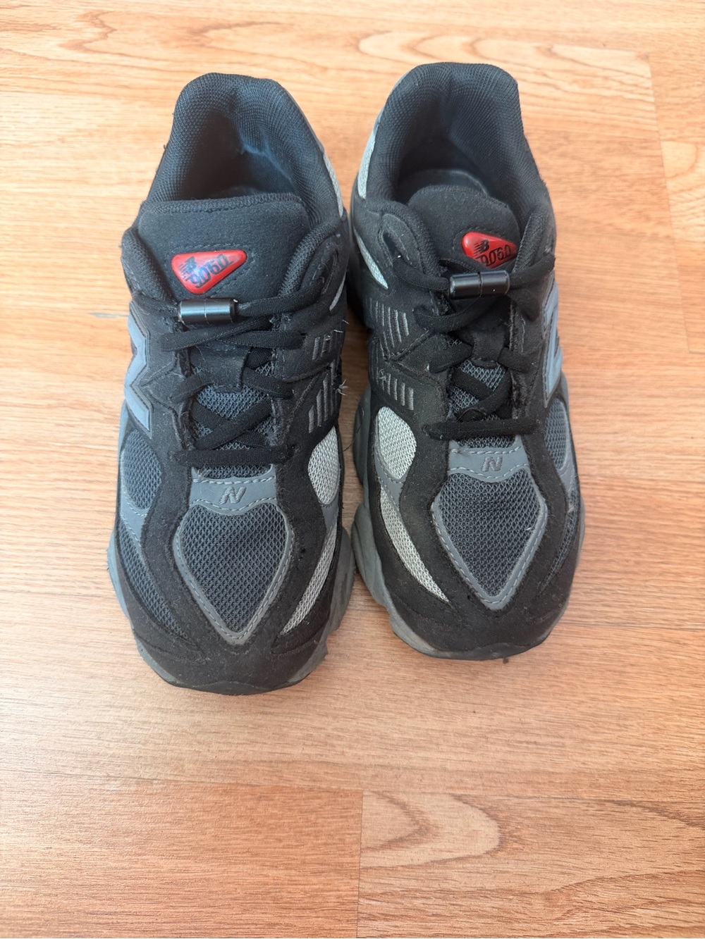 New Balance 9060 Black and Gray kid’s Athletic Sneakers with Red Accent
